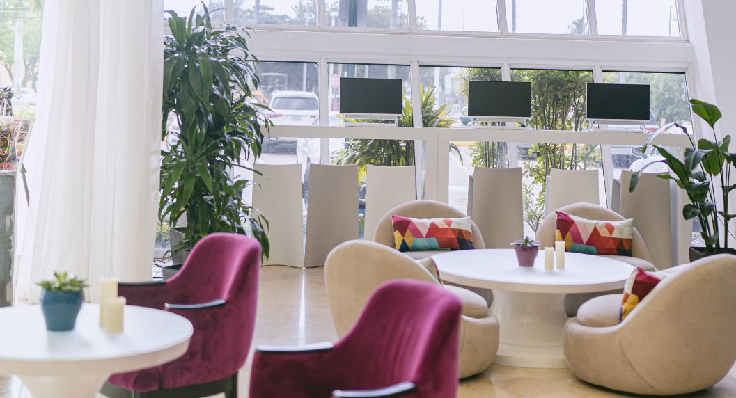 view of computer station and sitting area at nuvo suites lobby